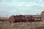 BM 1230 & BM 802 haul welded rail for the MBTA Green Line 'D' Branch past Boston Engine Terminal